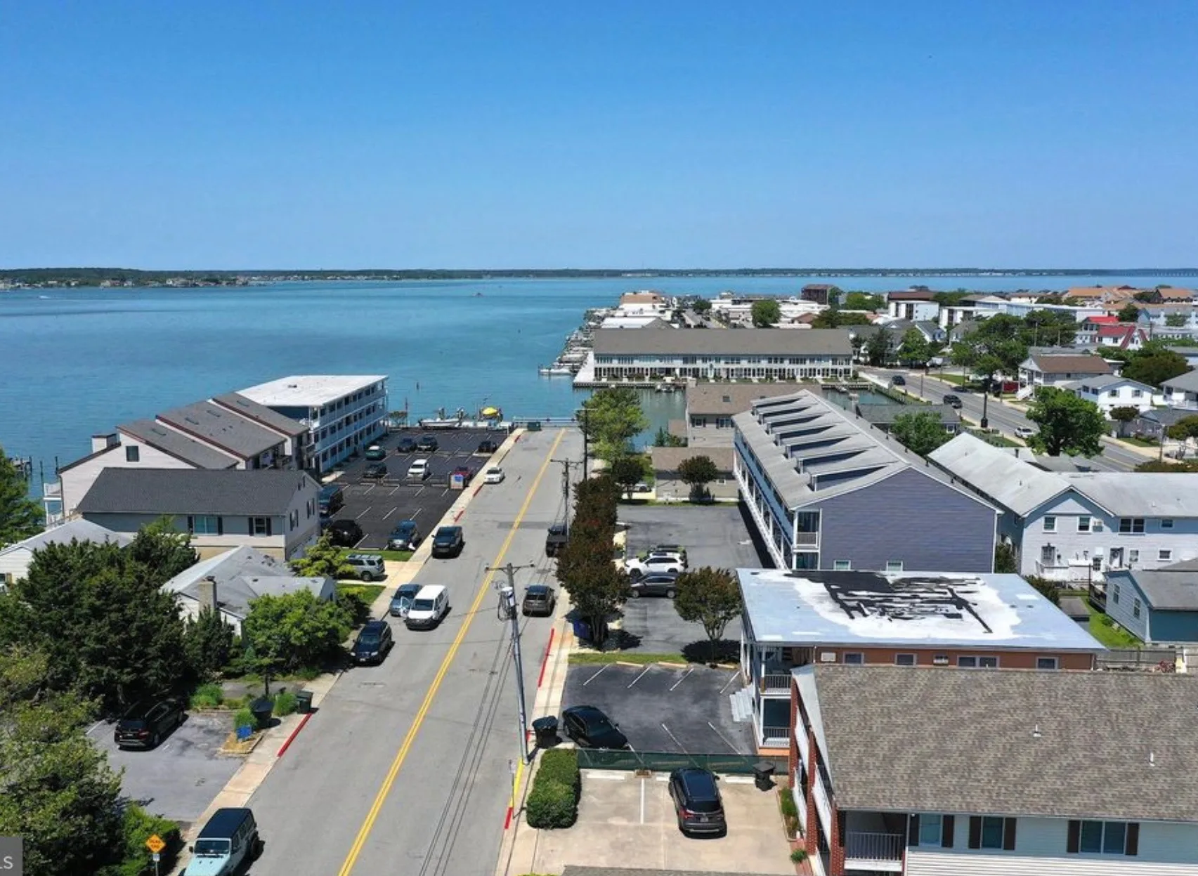 Condo Townhome Walking Distance to Boardwalk: 308 26th Street Ocean City, MD 21842 (in seven unit blue building in drone picture) — photo 1 of 2